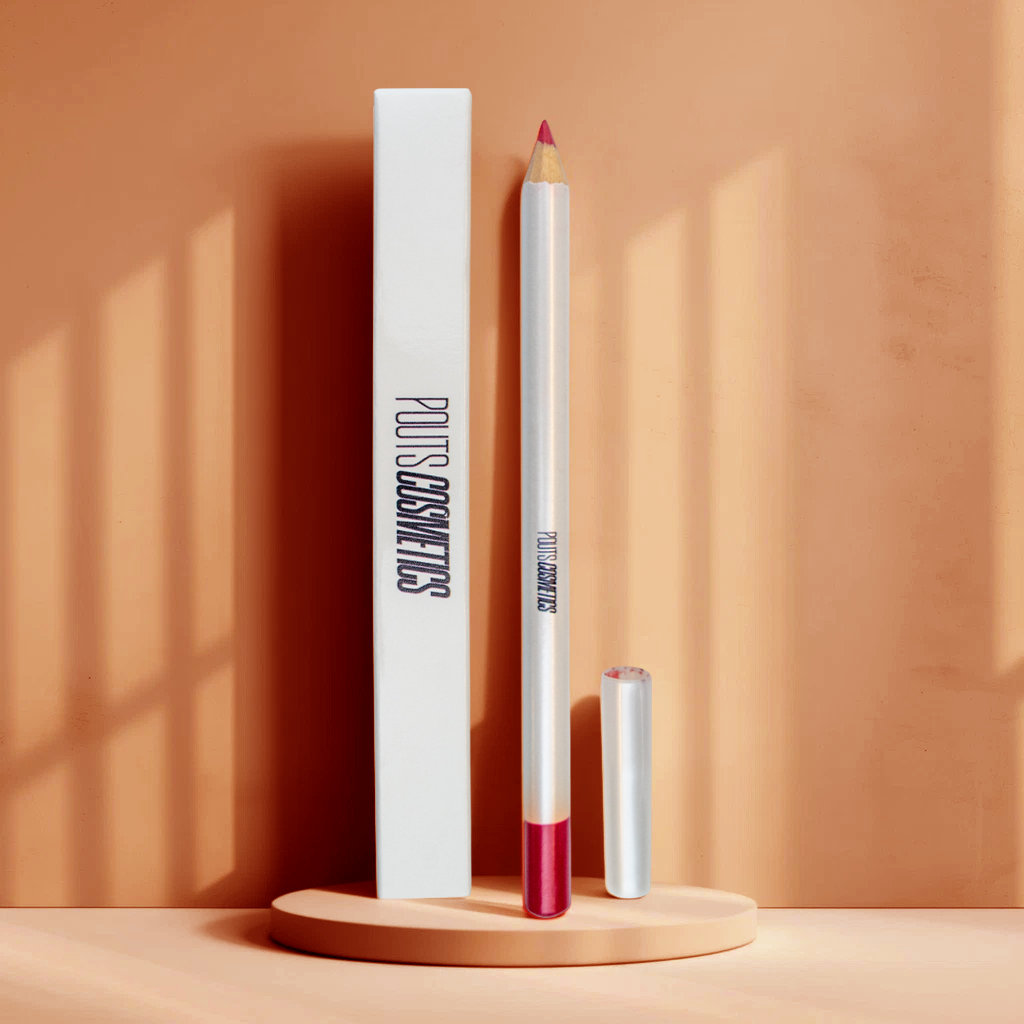 Lip liner with white casing and red tip on a beige background